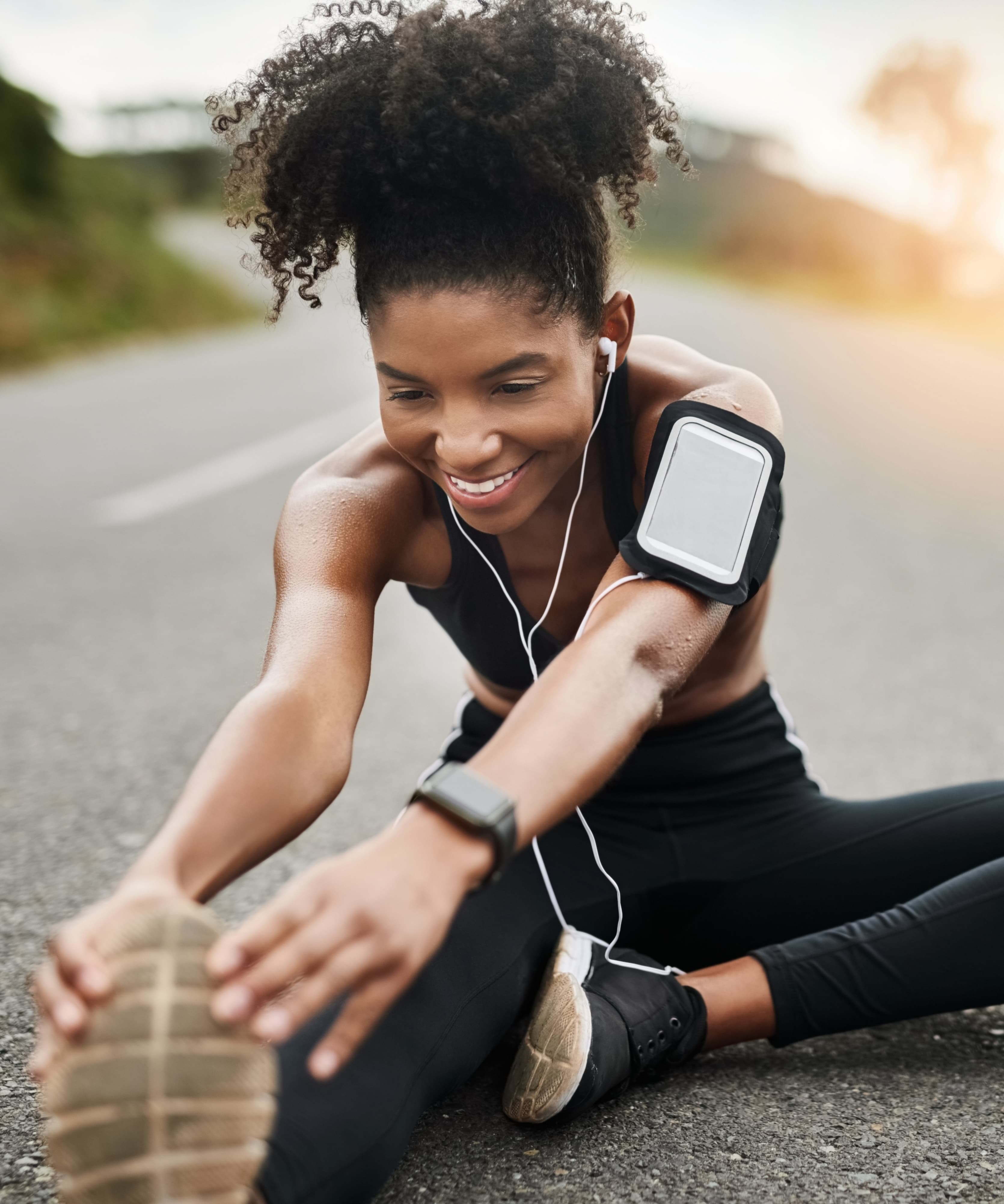 Woman stretching on the road