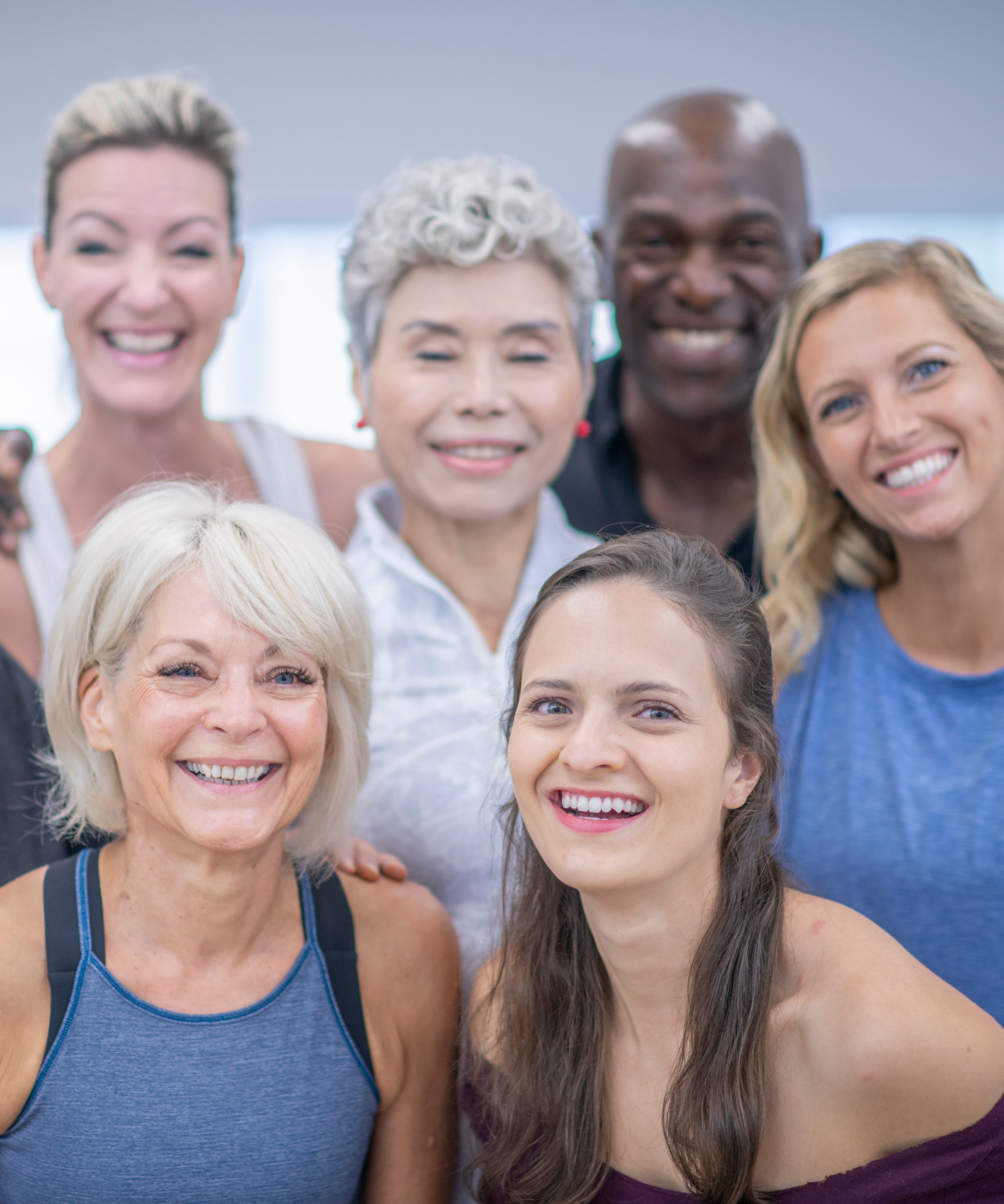 Group of people dressed in workout clothes